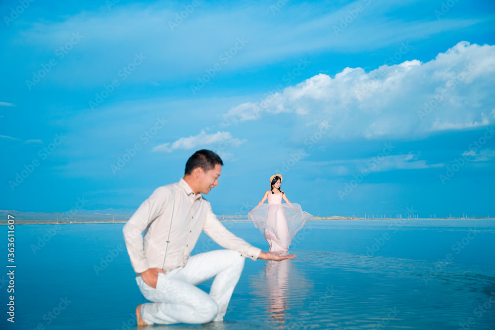 A couple frolicking in a lake in the sea. A couple frolicking in a lake in the sea.
