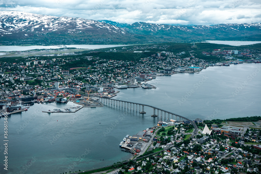 Panorama Tromso city, northern Norway. Beautiful landscape with sea, island and mountains. Town on the island with bridge.