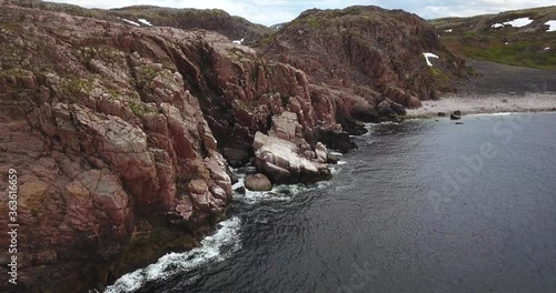 Flock of seagulls, Aerial view of Barents Sea coastline , Teriberka, Kolsky District, Murmansk region, Russia photo