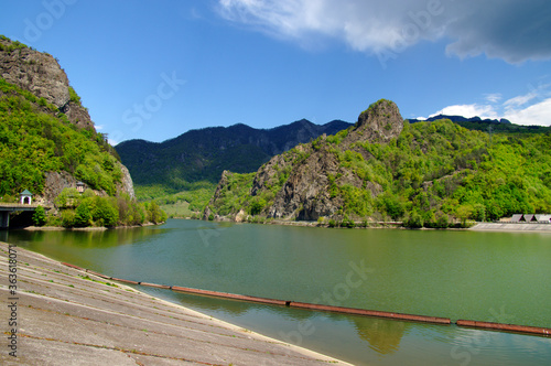 Landscape of Olt Valley with Olt river and Cozia Mountains in Romania