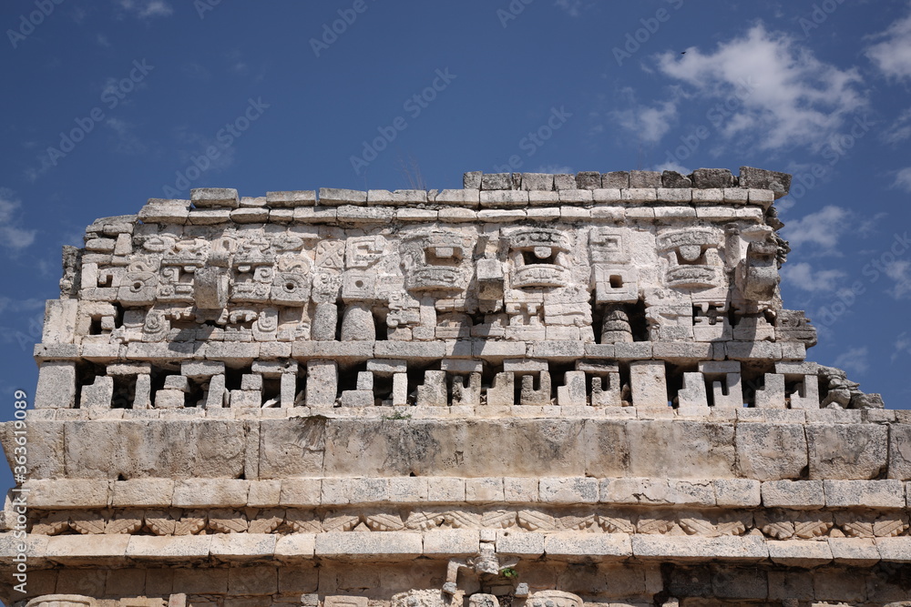 Ancient Mayan ruins the temple with three-dimensional masks of the Maya god of rain chac, at Chichen Itza, Mexico