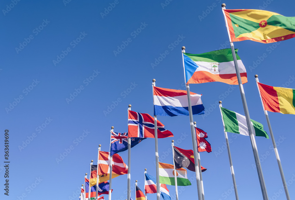 waving in the wind flags of different countries waving in the wind flags of different countries