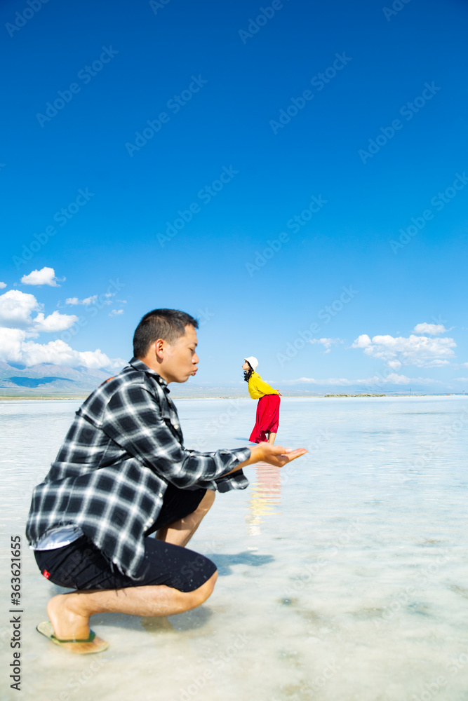 A couple frolicking in a lake in the sea. A couple frolicking in a lake in the sea.