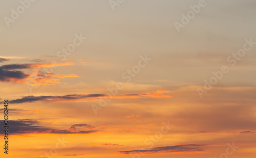 Sunset. Fuzzy cloud outlines in orange haze. Natural background. © Stepanov Aleksei