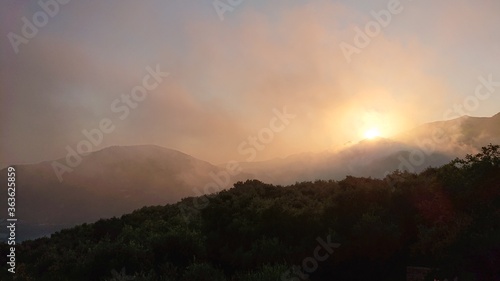 sunrise in the mountains with fog