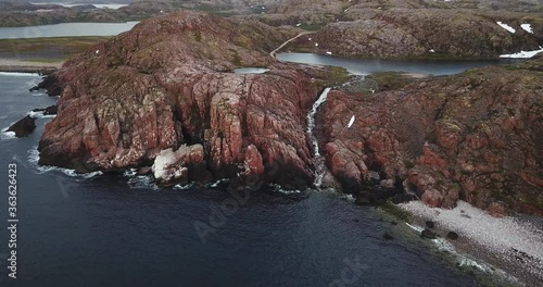 Aerial view of waterfall at Barents Sea coastline , Teriberka, Kolsky District, Murmansk region, Russia photo