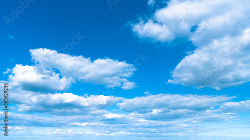 Blue sky with white clouds after a thunderstorm landscape.