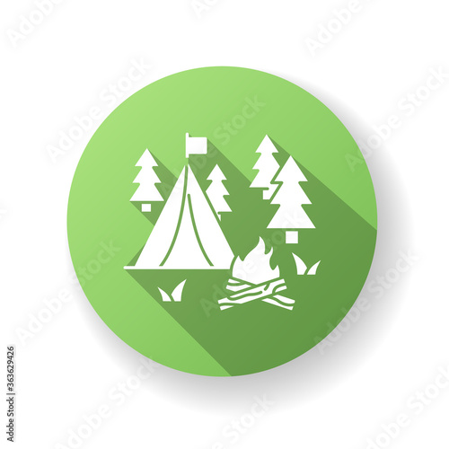 Camping green flat design long shadow glyph icon. Nature tourism, outdoor recreation. Inexpensive vacation, overnight stay in forest. Campfire and tent in woods silhouette RGB color illustration