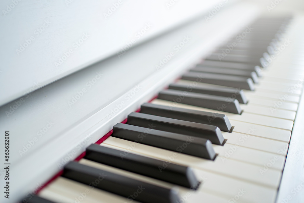 Down piano looking over the keys. shallow depth of field. Classical music on electronic digital piano. beautiful piano keys close up. Down piano looking over the keys. shallow depth of field. Classical music on electronic digital piano. beautiful piano keys close up.