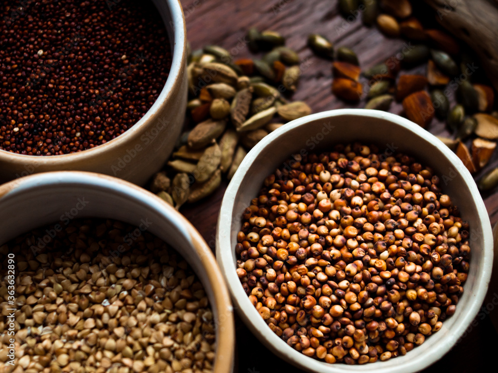 Traditional whole foods, grains, nuts and seeds in rustic, natural light setting with custom made cermics. Traditional whole foods, grains, nuts and seeds in rustic, natural light setting with custom made cermics.