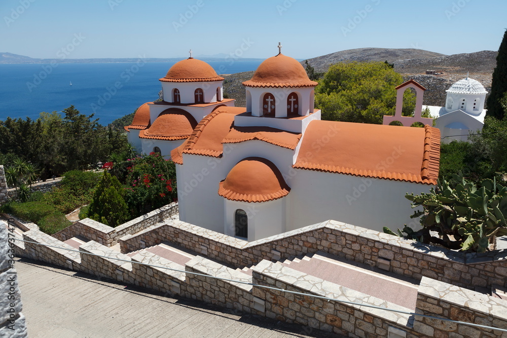 Obraz premium Monastery of Agios Savvas located on top of a hill above Pothia Town, the capital of Kalymnos, Dodecanese, Greece