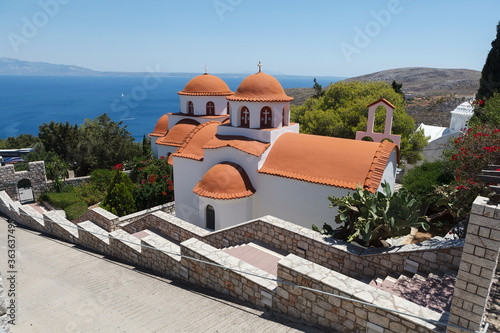 Monastery of Agios Savvas located on top of a hill above Pothia Town, the capital of Kalymnos, Dodecanese, Greece photo