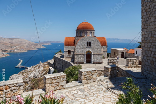 Monastery of Agios Savvas located on top of a hill above Pothia Town, the capital of Kalymnos, Dodecanese, Greece photo