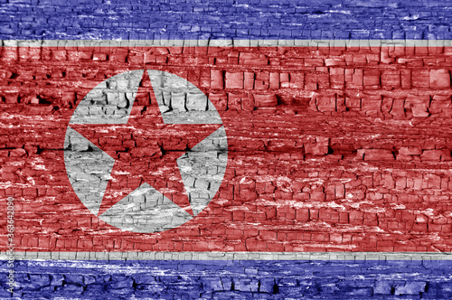 Flags of North Korea on wooden wall. Background on topic of international conflict