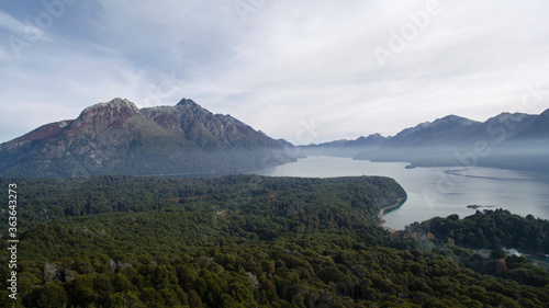 Wilderness. Aerial view of lake Nahuel Huapi  the forest foliage  mist and mountains. 