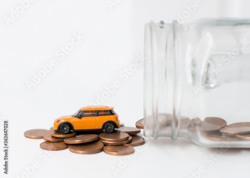 Murais de parede A model car is on coins