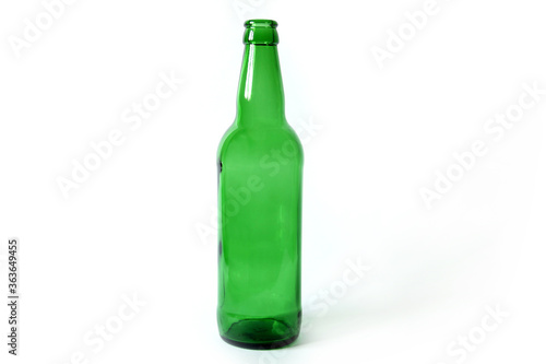 Glass bottle on a white background. Empty bottle. Green bottle on a clean background