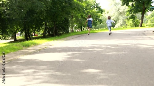 Wallpaper Mural Cute kids running together in a summer park. Happy siblings outdoor activity. Torontodigital.ca
