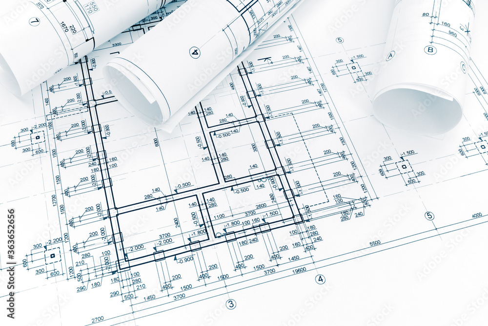 construction plan, rolls of technical blueprints. architectural background.