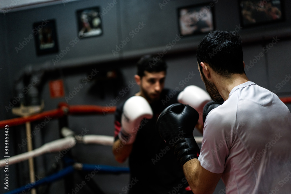 Men During Boxing Workout On The Ring.