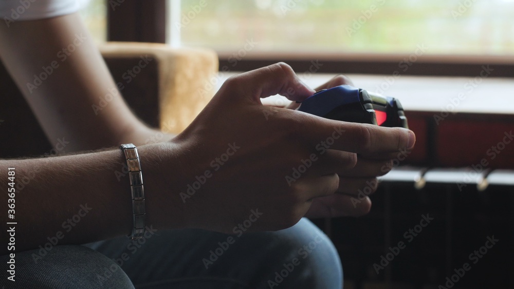 Man holding joystick for video game