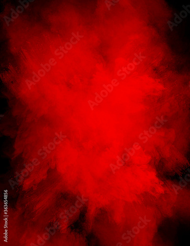 Powder explosion in a vibrant color with a black background with copy space in the powder