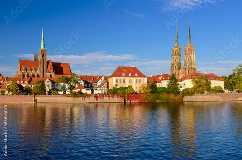 Sightseeing of Poland. Cityscape of Wroclaw. The view at Tumski island and Cathedral of St John the Baptist, Church of Our lady on the Sand, Odra river. 