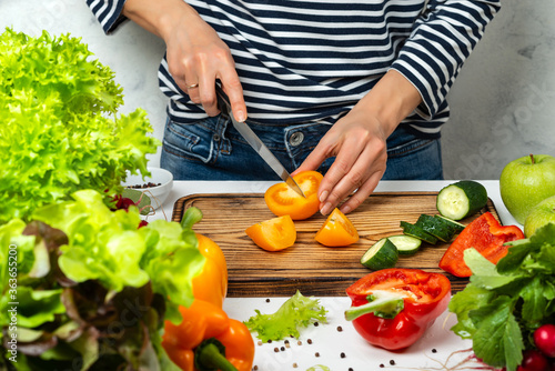 Fototapeta Naklejka Na Ścianę i Meble -  Cooking healthy vegan diet food concept. Cutting vegetables in the kitchen.