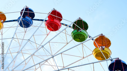 Several multi-colored cabins of ferris wheel