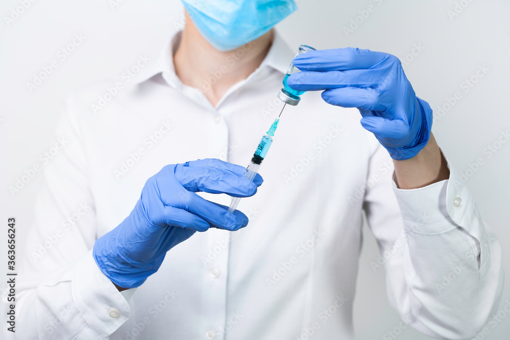 female doctor holding syringe female doctor holding syringe