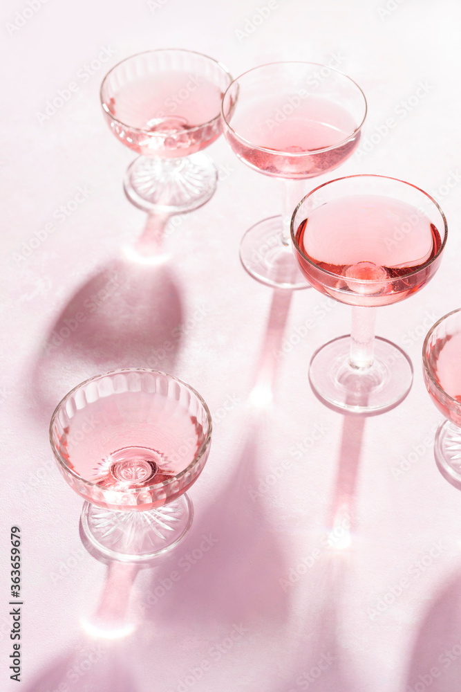 Glasses of Rose on Pink Background Glasses of Rose on Pink Background