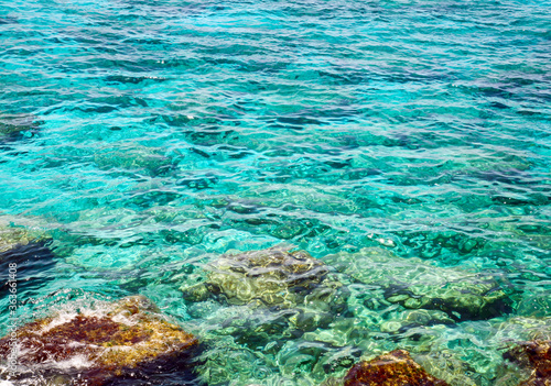 Fototapeta Naklejka Na Ścianę i Meble -  Transparent turquoise sea and colorful stones in the Mediterranean Sea in Cyprus