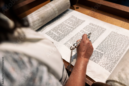 Synagogue: Anonymous Woman Congregant Reading From The Torah photo