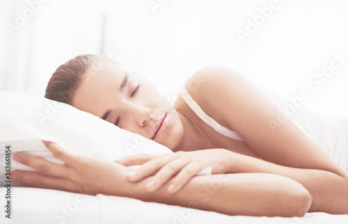 Beautiful girl sleeps in the bedroom, relax