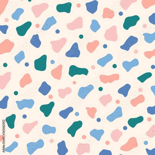seamless pattern background with different colourful shapes and polka dots