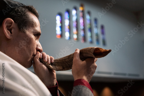 Synagogue: Man Blowing Shofar For High Holidays photo