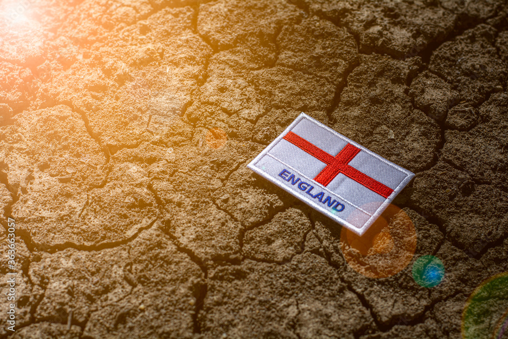 Fototapeta premium England flag on abandoned cracked ground.