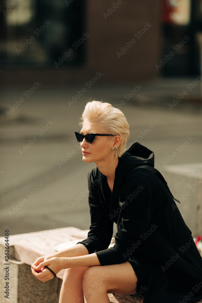 Street Portrait of beautiful woman with retro sunglasses Street Portrait of beautiful woman with retro sunglasses