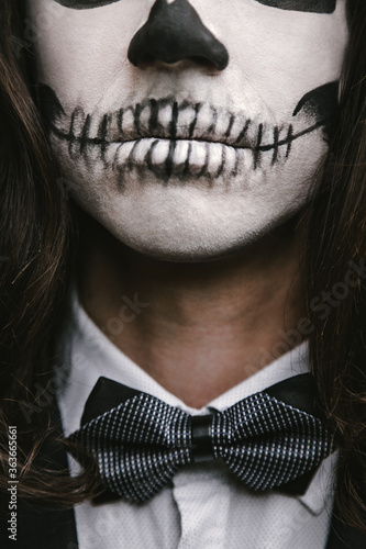portrait of young man with skull Halloween facepaint