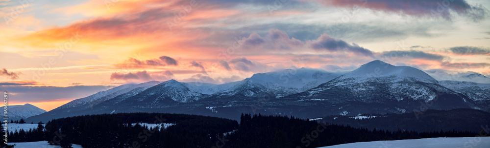 Sunset clouds over snowy mountains Sunset clouds over snowy mountains