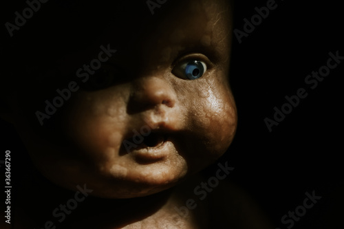 close up of a vintage baby doll, in the shadow photo