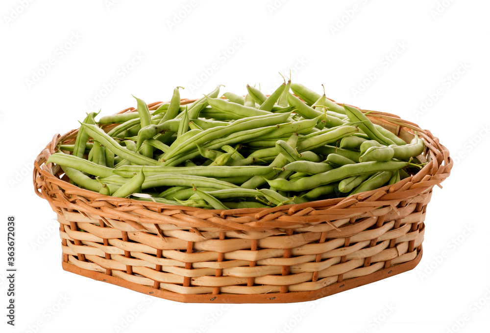 pods in wicker basket on isolated white background pods in wicker basket on isolated white background