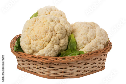 cauliflowers in wicker basket on isolated white background