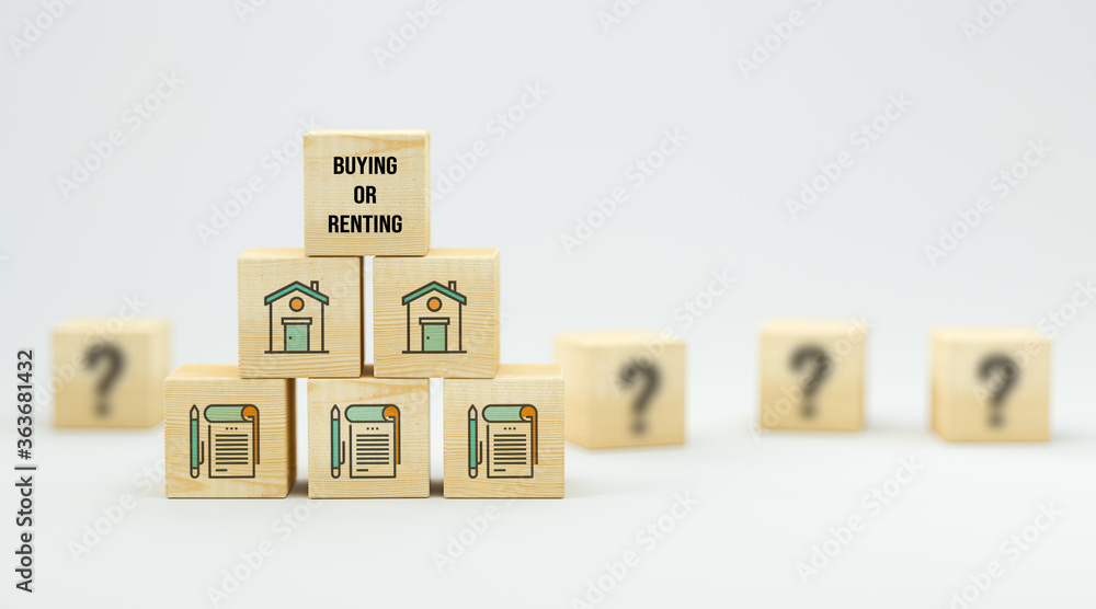 cubes with house symbols and message BUYING OR RENTING on white background cubes with house symbols and message BUYING OR RENTING on white background