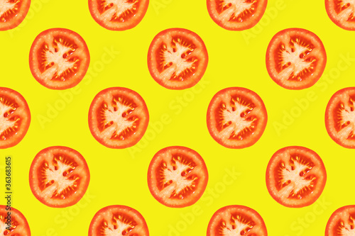 Seamless pattern of tomato slices on a yellow background. A simple drawing for the surface of packaging, textiles, advertising.