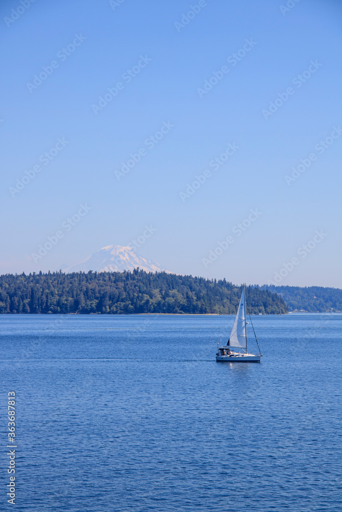 Boat sailing with view of Mt Rainier in distance