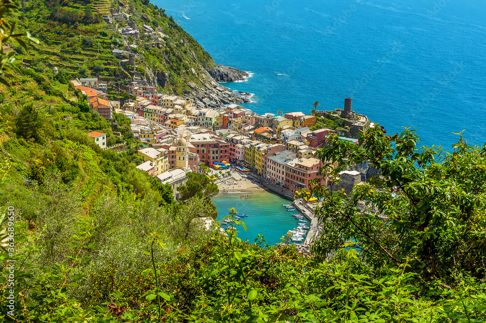 A close up view from the Monterosso to Vernazza path looking down over Vernazza in the summertime