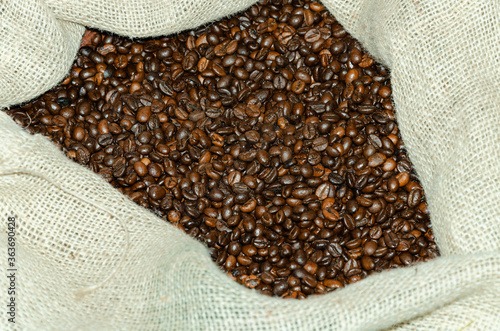 coffee beans, brown in burlap from natural threads