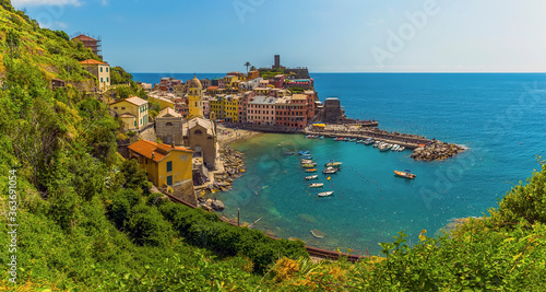 A panorama view over the picturesque village and harbour of Vernazza in the summertime