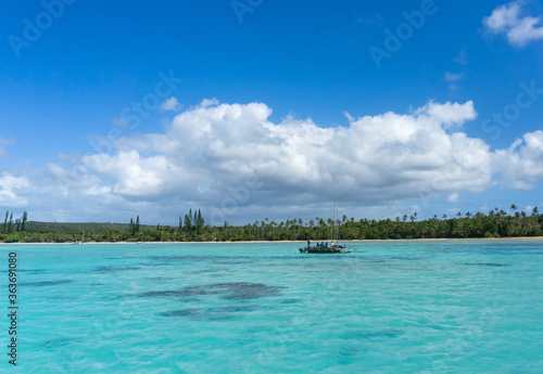 Fototapeta Naklejka Na Ścianę i Meble -  Boat trip on a traditional caledonian sailing boat in Upi bay,  Isle of pines, New Caledonia. turquoise sea and blue sky